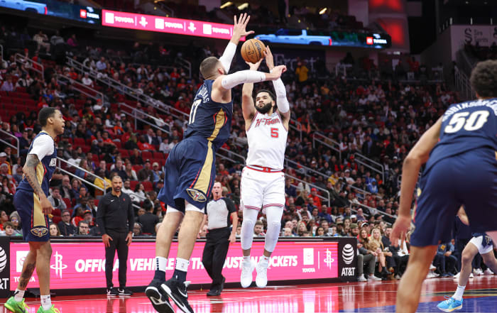 Rockets guard Fred VanVleet (5) shoots the ball as New Orleans Pelicans center Jonas Valanciunas (17) defends during the fourth quarter at Toyota Center.